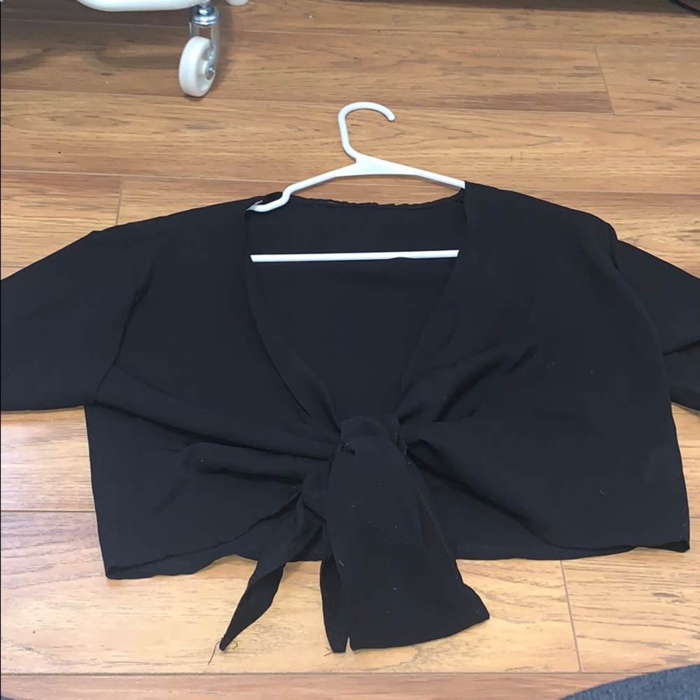 Cropped tie front top with ruffled sleeve details